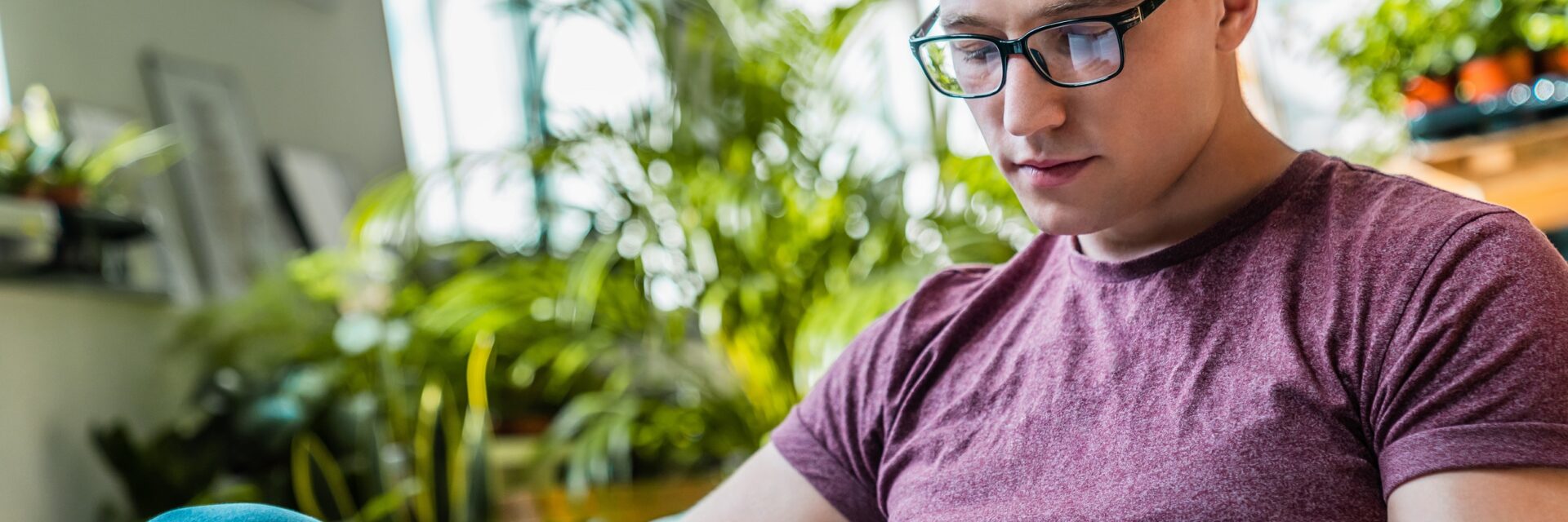 Young male adult reading a book